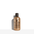 Bond-Building Repair Shampoo bottle with beige label and dark cap