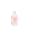 Bumble and bumble Invisible Oil shampoo bottle, white with pink-orange label, angled