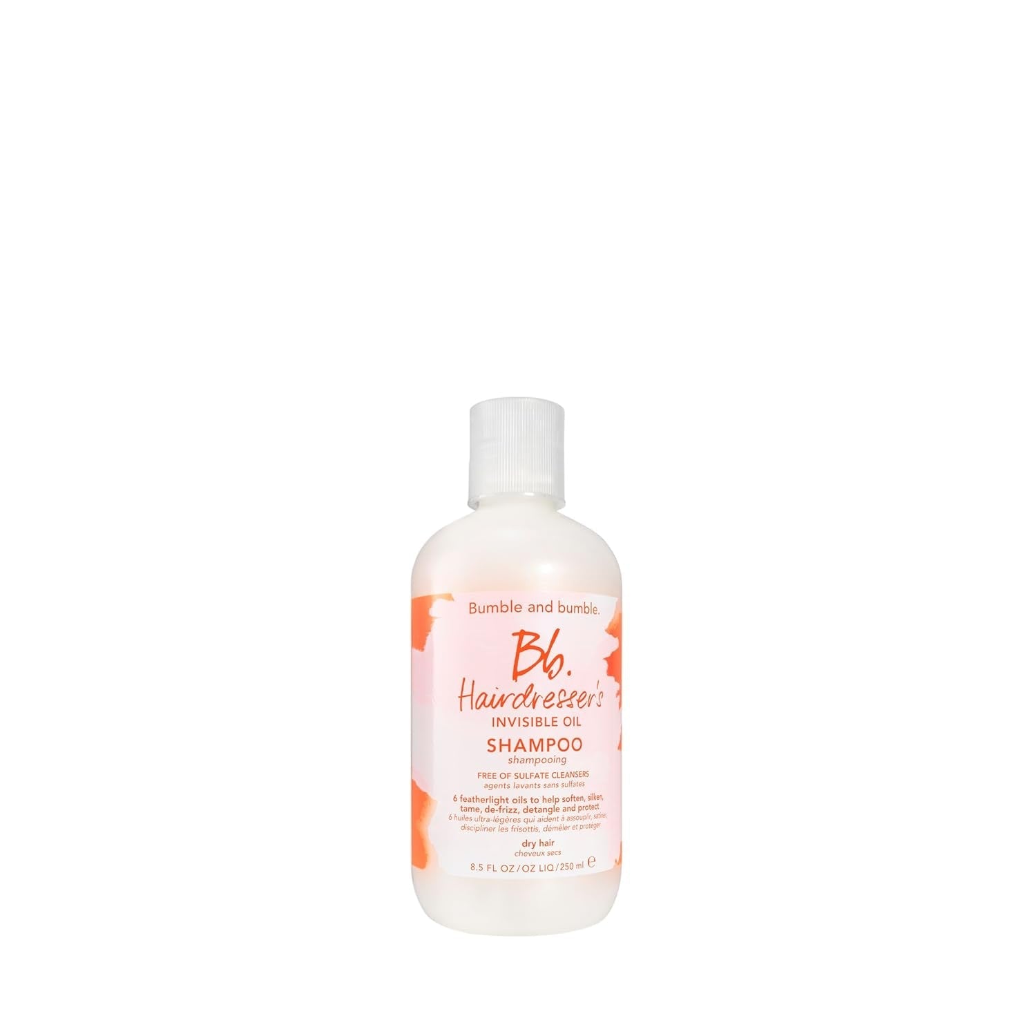 Bumble and bumble Invisible Oil shampoo bottle, white with pink-orange label, angled