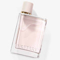 Burberry Her eau de parfum bottle, clear pink glass with gold cap