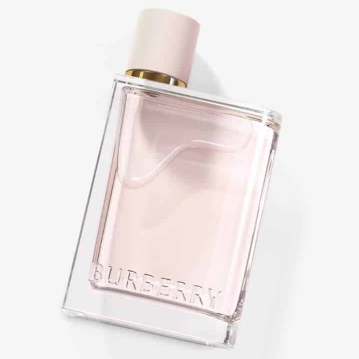Burberry Her eau de parfum bottle, clear pink glass with gold cap