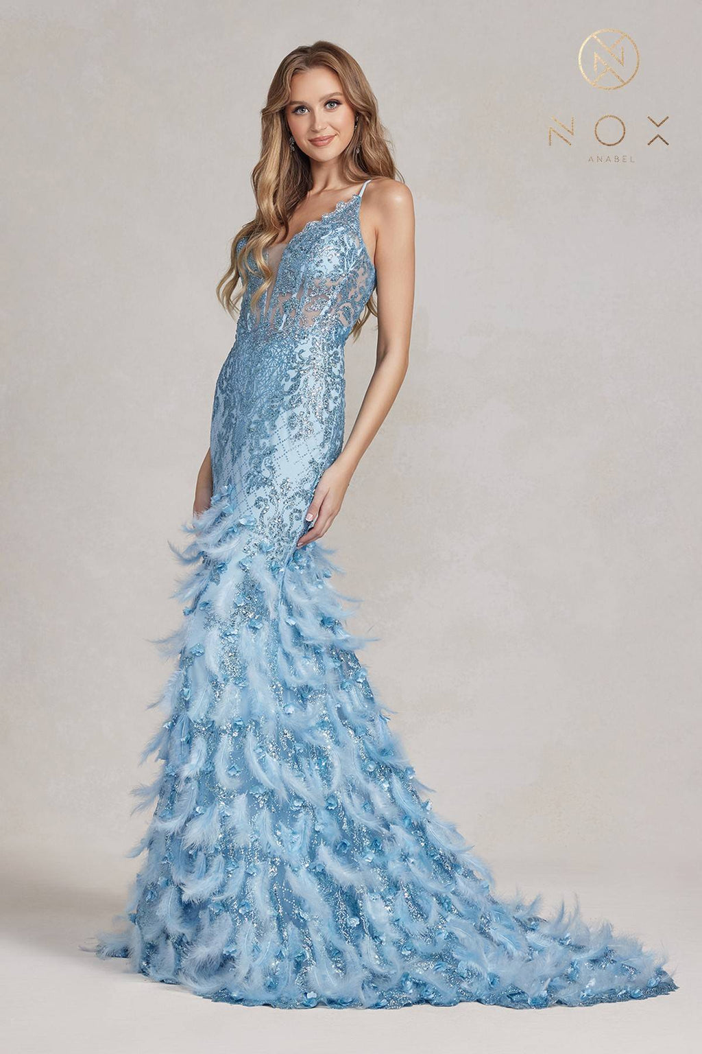 Light blue glitter mermaid gown with feather ruffle skirt and thin spaghetti straps
