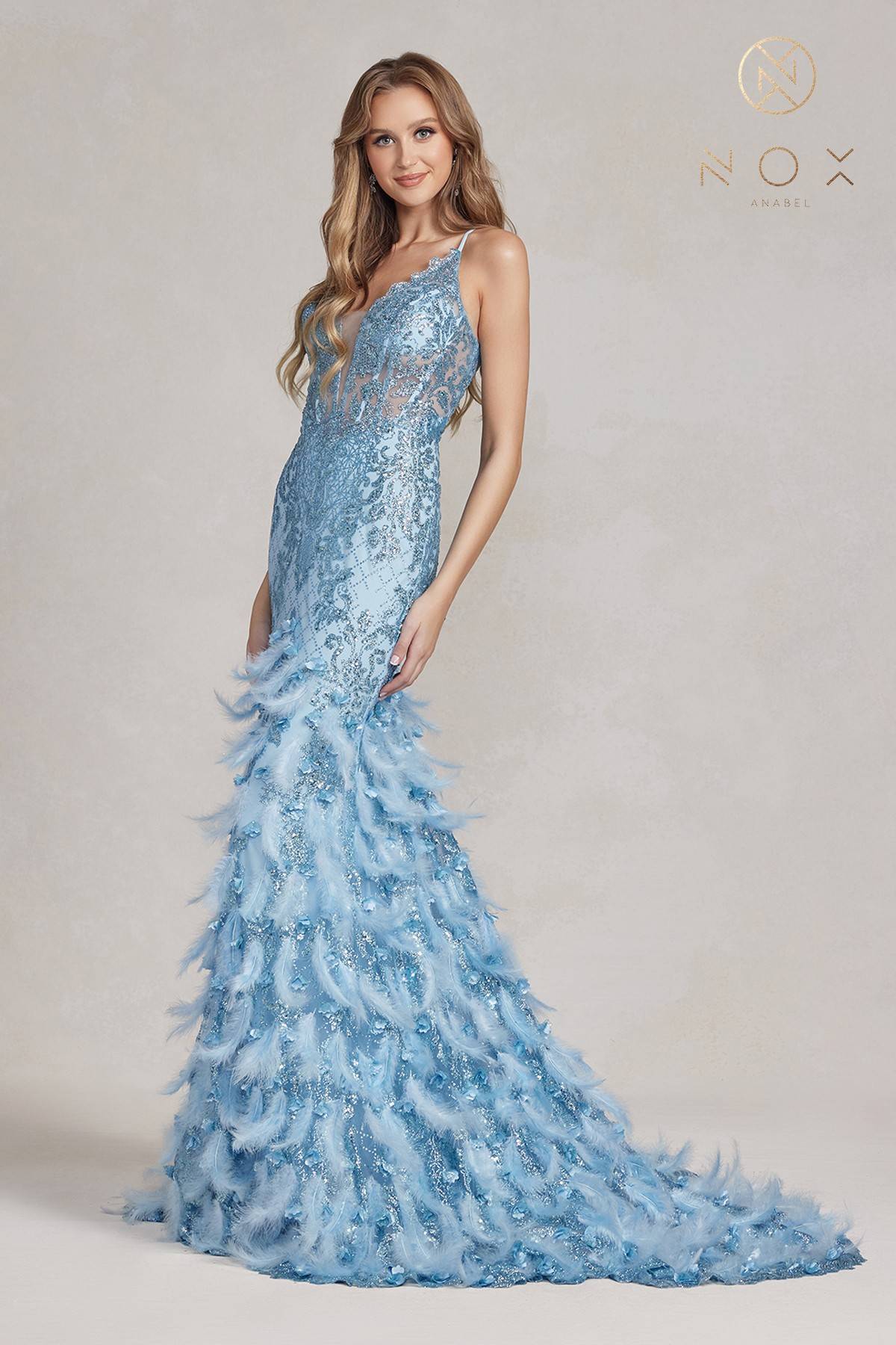 Light blue glitter mermaid gown with feather ruffle skirt and thin spaghetti straps