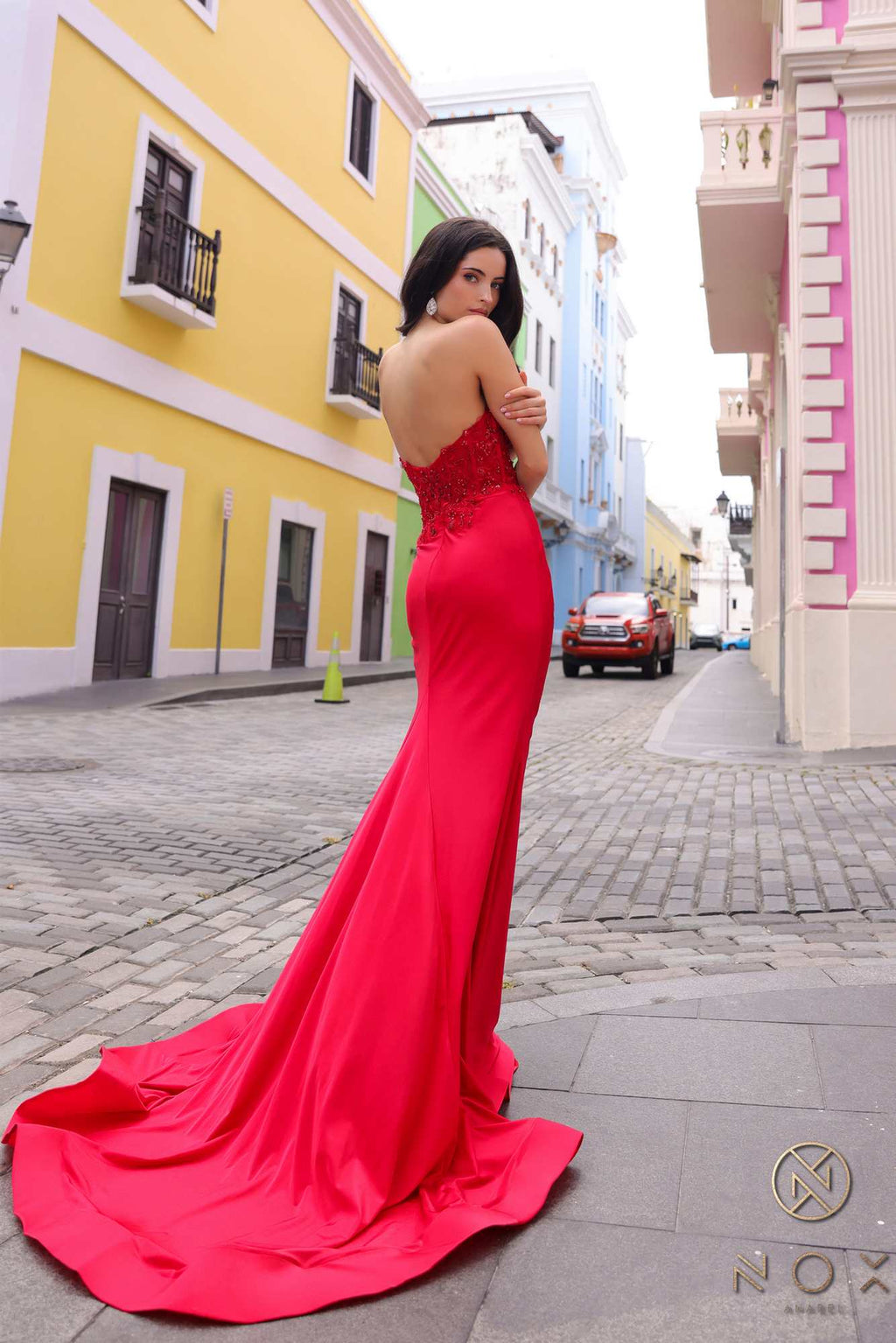 Red strapless corset mermaid gown, sweetheart neckline and flowing flare hem