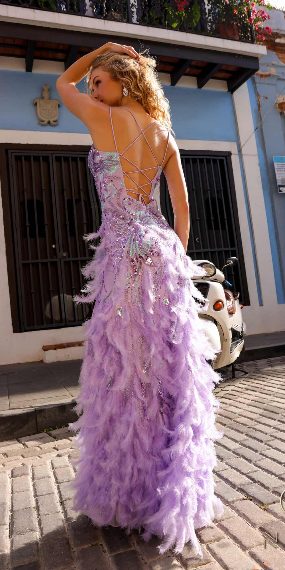 Lavender sequin embroidered gown with cascading feather ruffles
