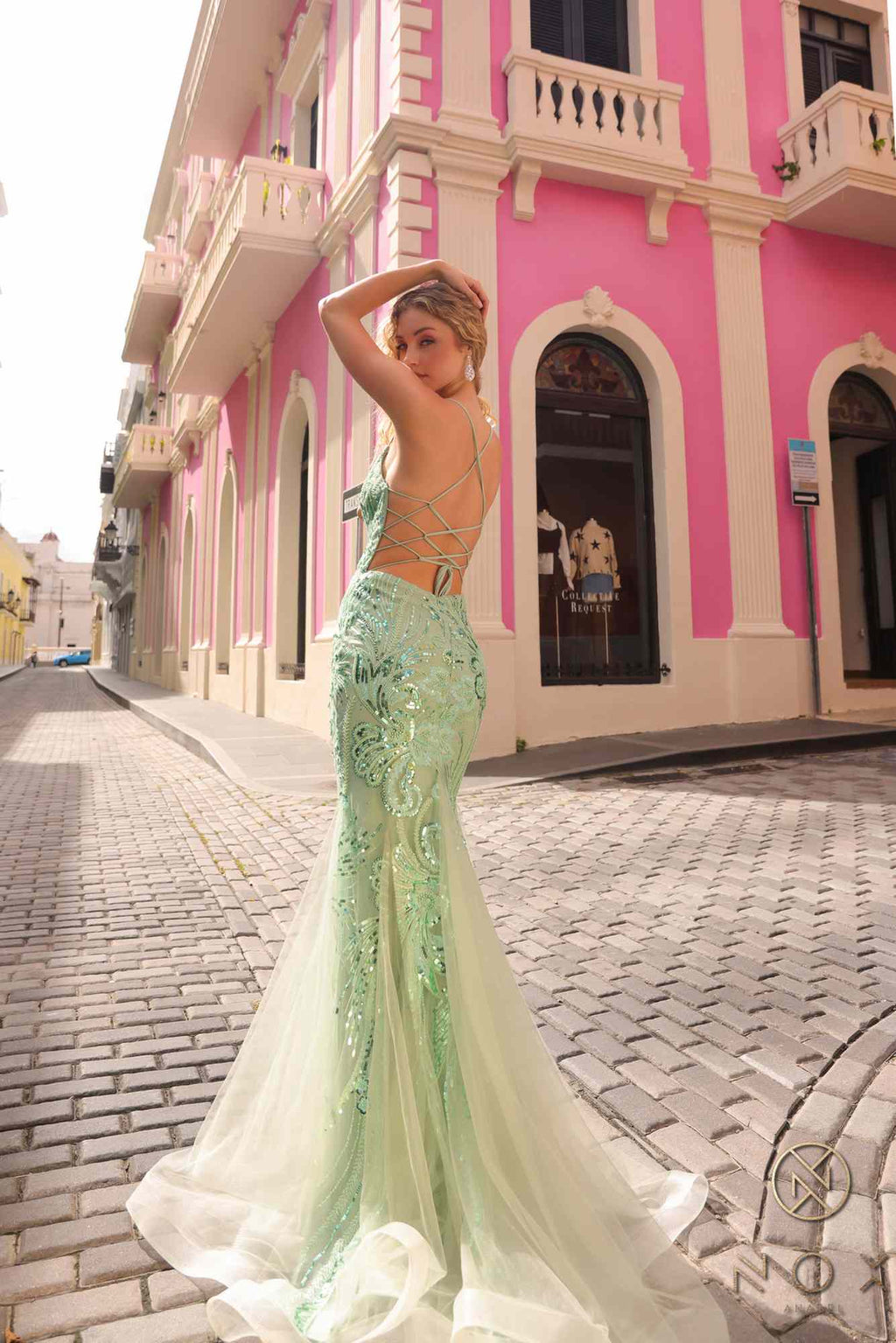 Sage green sequin mermaid gown with strappy open back and sheer tulle train