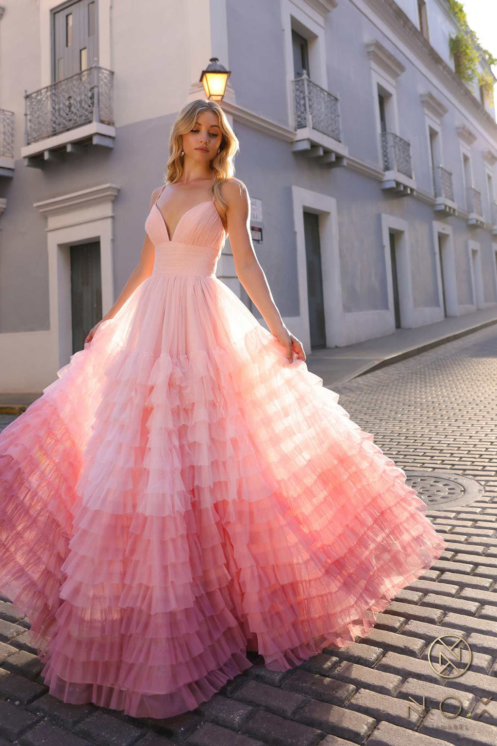 Blush ombre tiered ruffle A-line gown with spaghetti straps and V-neck, flowing skirt