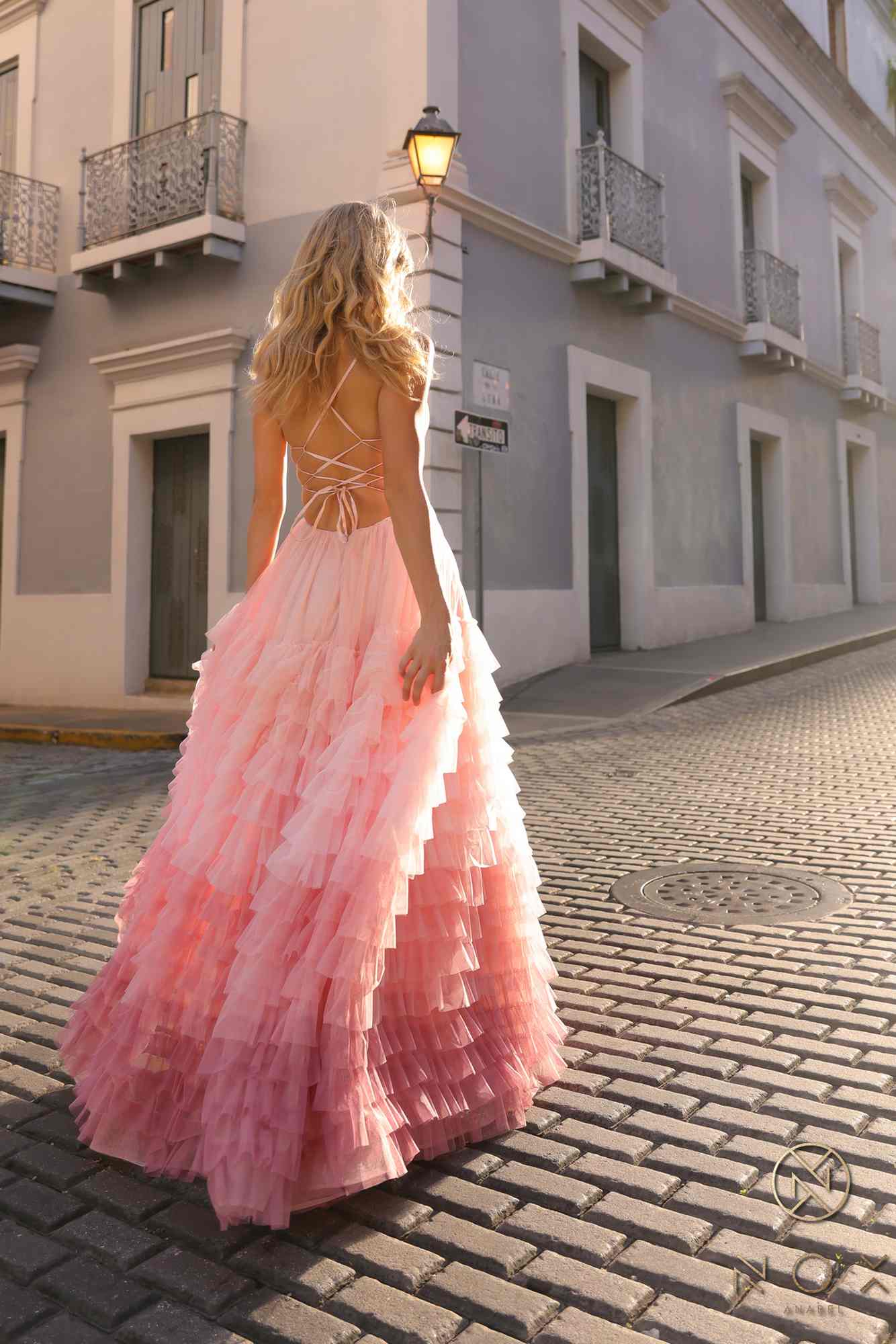 Blush ombre tiered ruffle A-line gown with spaghetti straps and open back