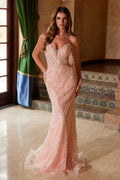 Blush pink strapless beaded tulle gown with fitted silhouette and long train