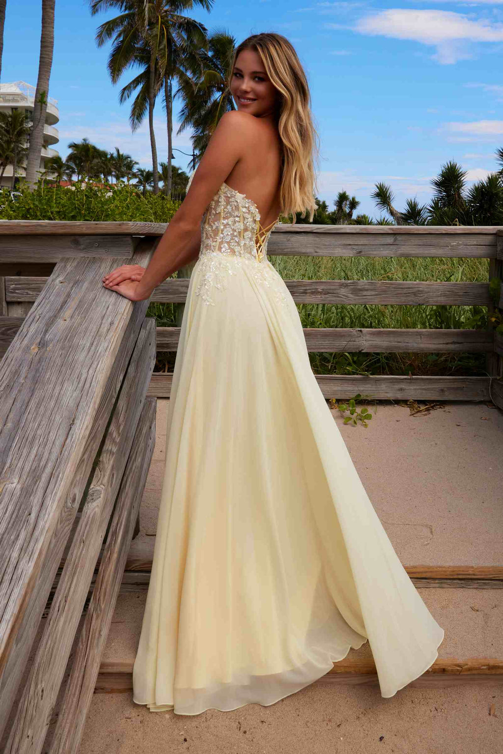 Lemon strapless corset dress with lace applique bodice and chiffon maxi skirt, side view