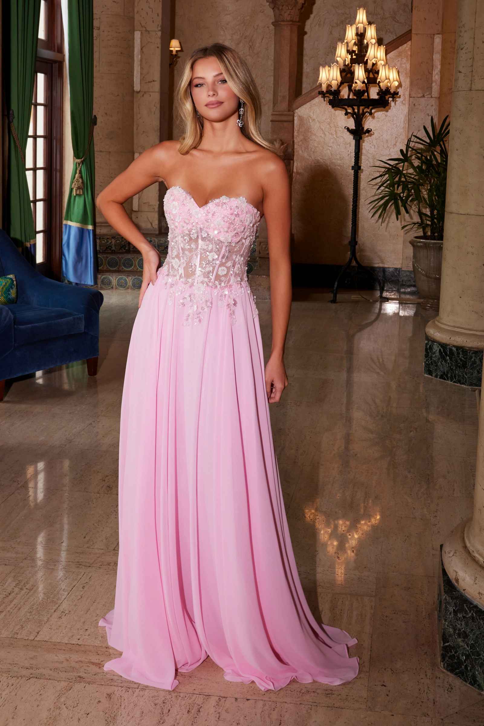 Pink strapless corset dress with floral applique bodice and flowing chiffon skirt