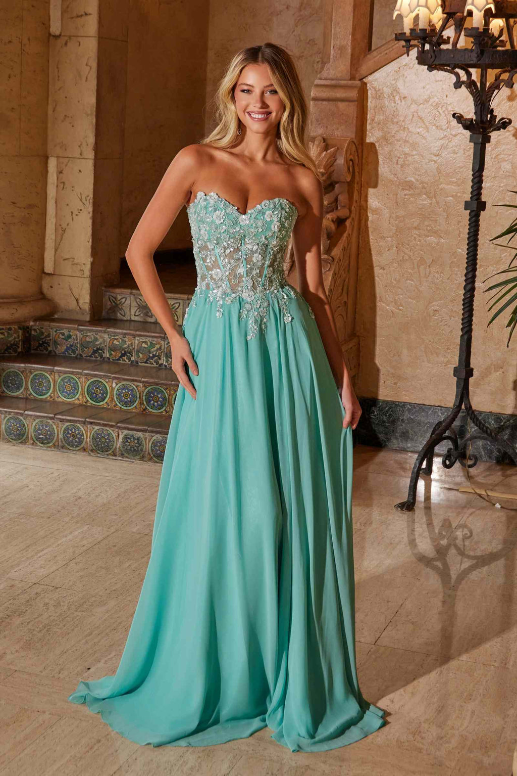 Turquoise strapless corset dress with embellished bodice and flowing chiffon skirt