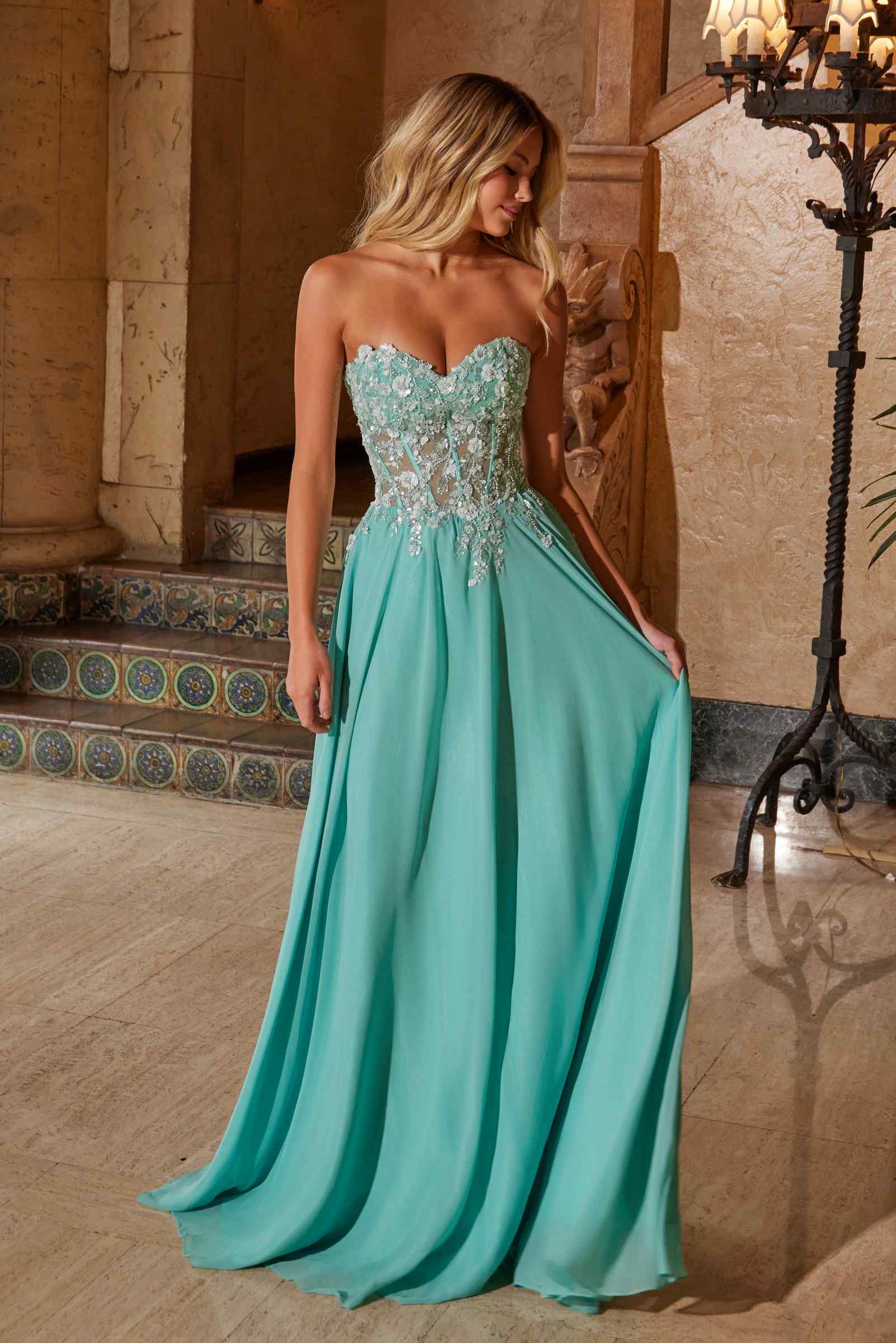 Turquoise strapless corset dress with detailed bodice and flowing chiffon skirt
