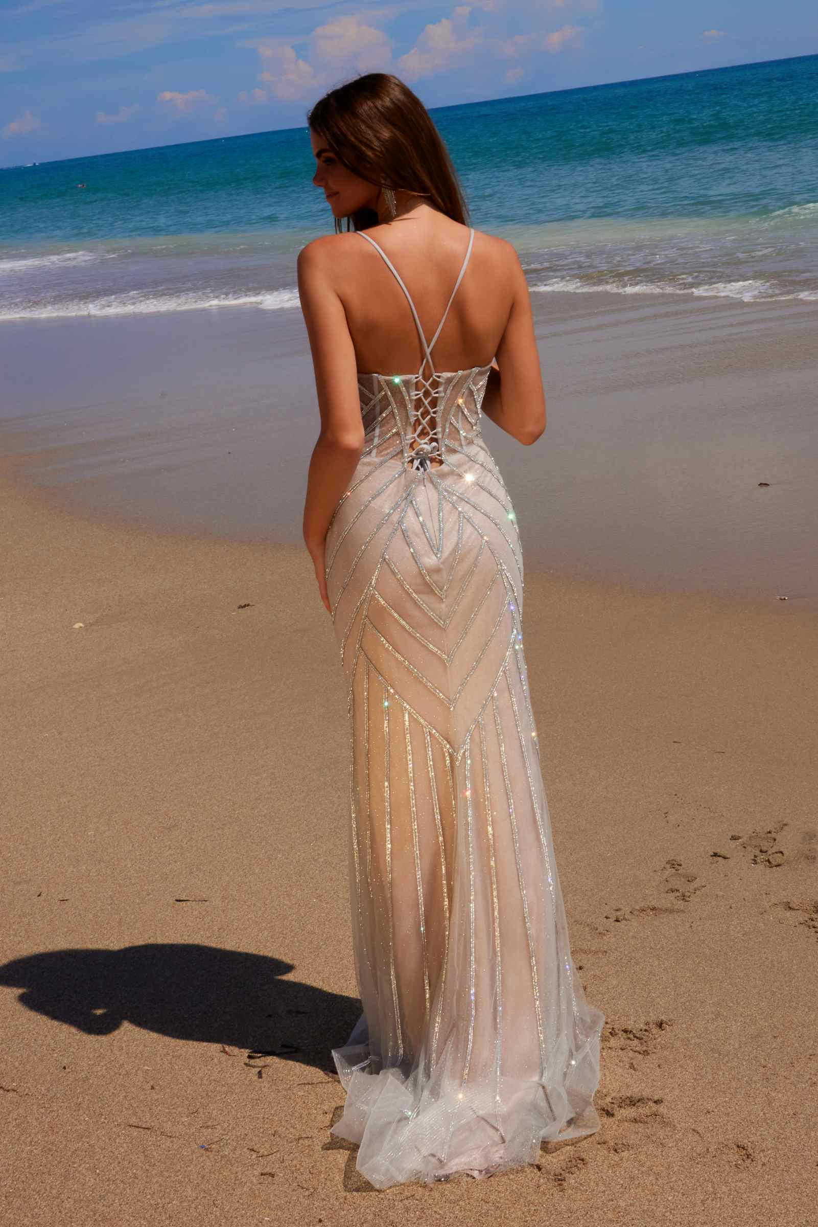 Silver sequin tulle gown with crisscross back straps and floor-length hem