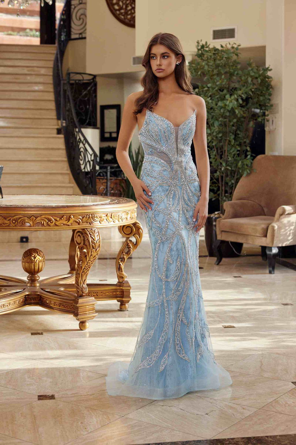 Light blue beaded fitted prom gown with peaked neckline, mermaid silhouette