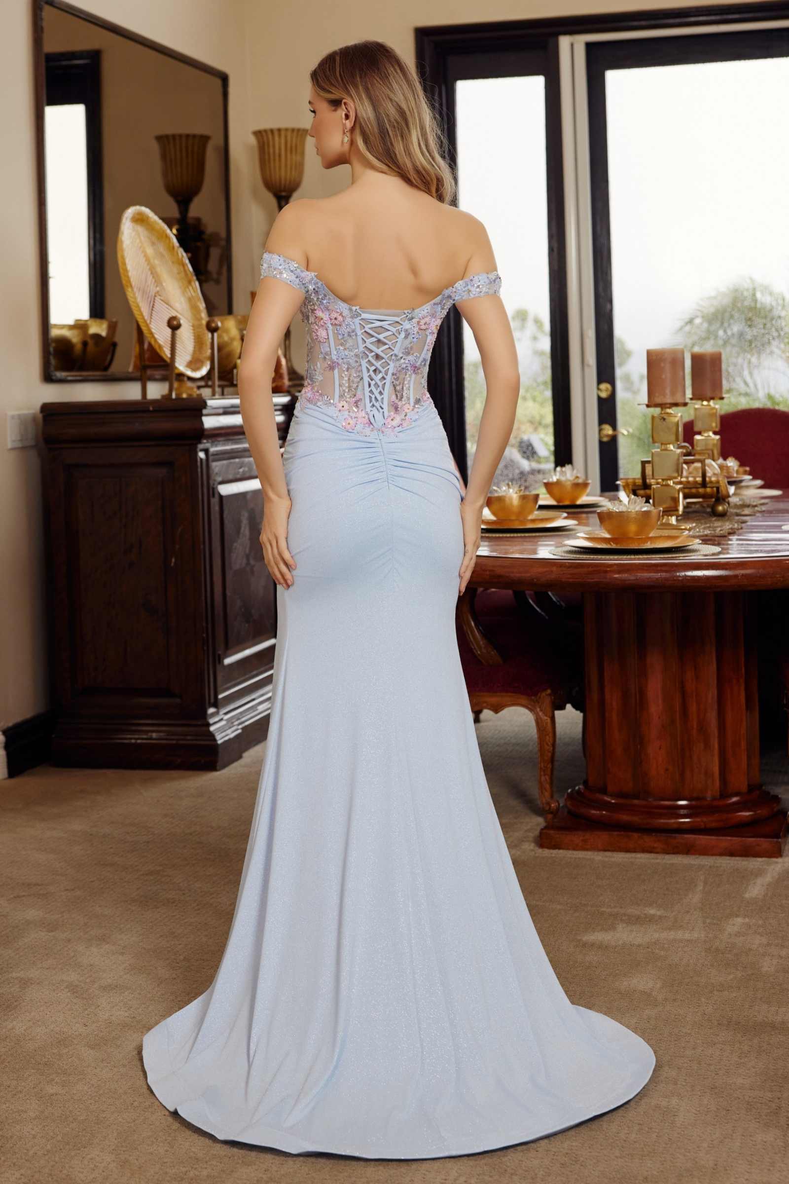 Light blue fitted prom gown from back, off-shoulder neckline and shimmer corset detail
