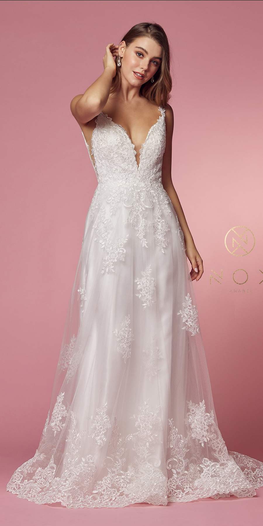 White lace A-line ball gown with V-neck, lace straps, and side cutout detail.