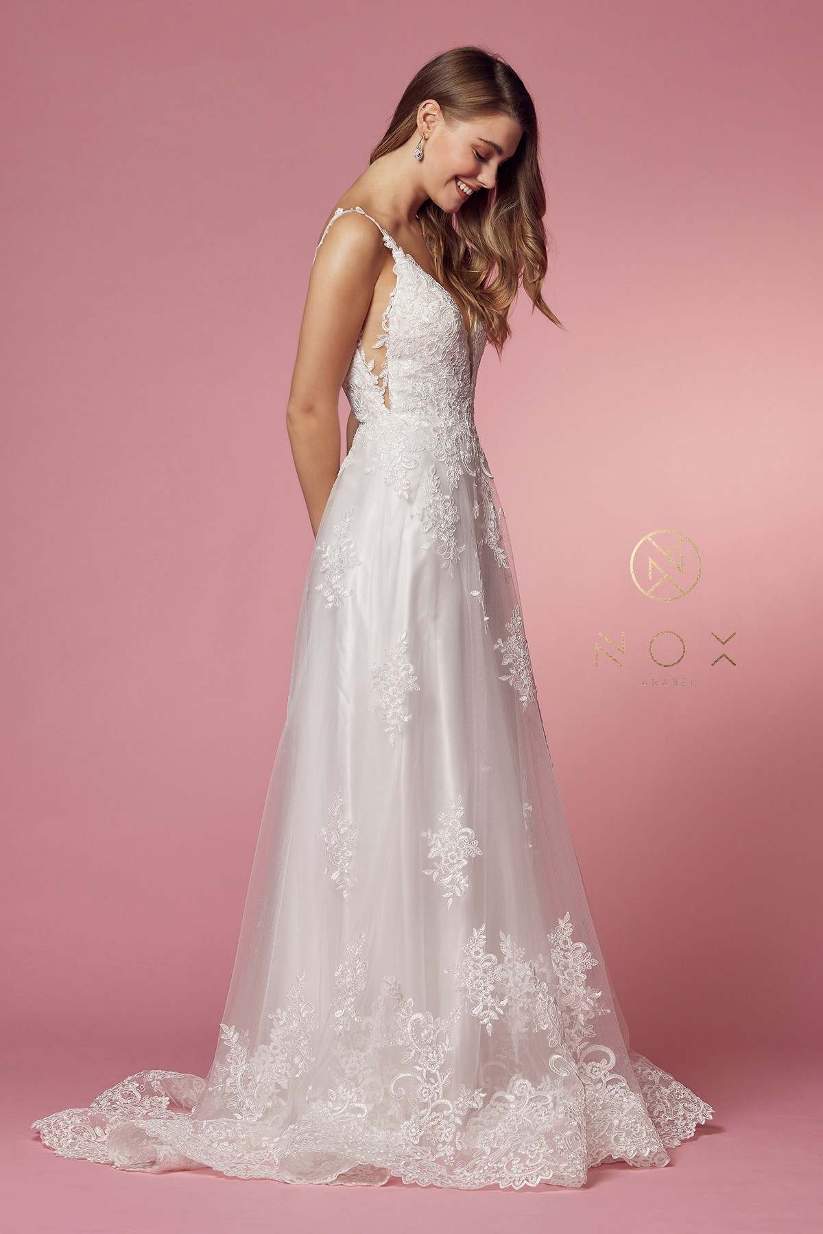 White lace A-line V-neck ball gown with lace straps and scalloped hem train.
