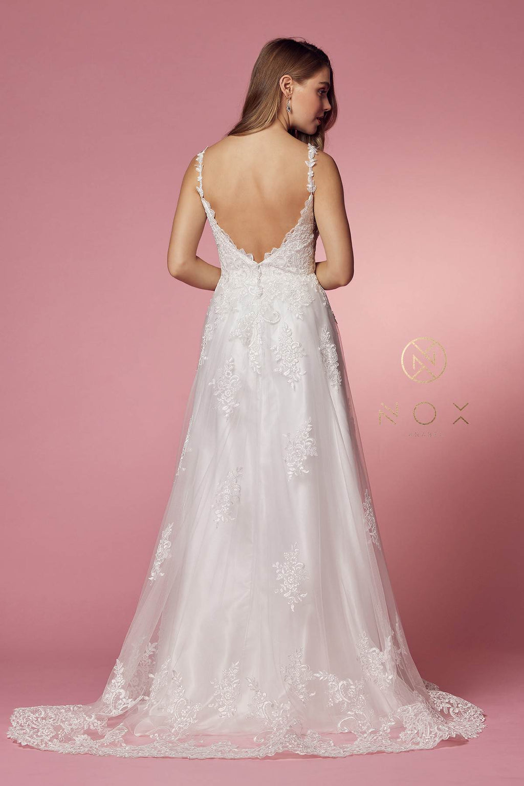 White lace A-line ball gown with V-neck and open back with lace straps.