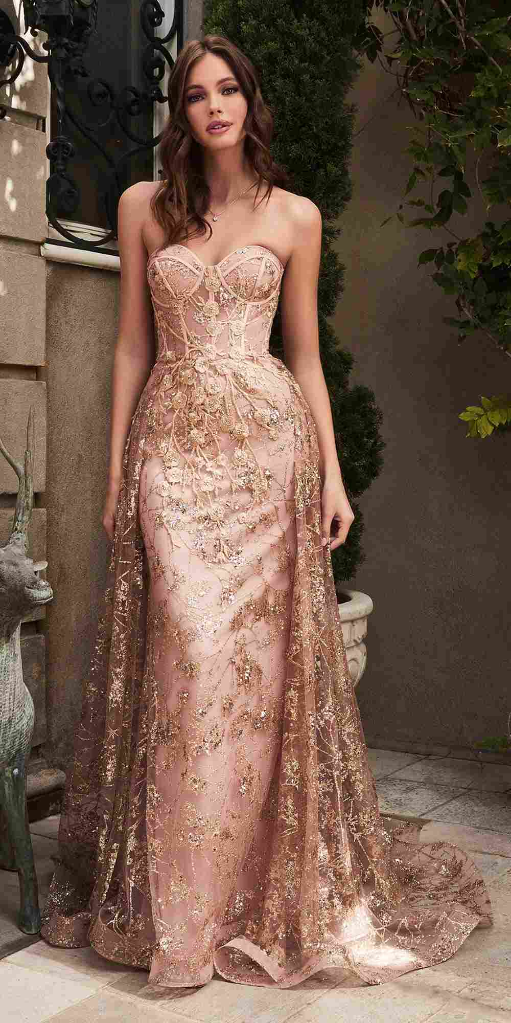 Rose-gold strapless glitter gown with floral lace texture and flowing skirt
