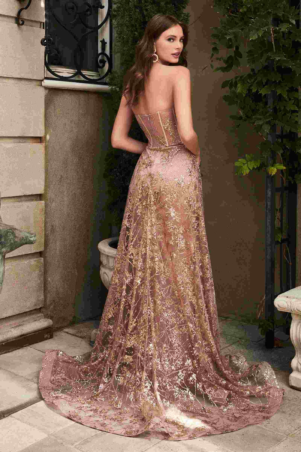 Rose-gold strapless glitter gown with corset bodice and long flowing skirt