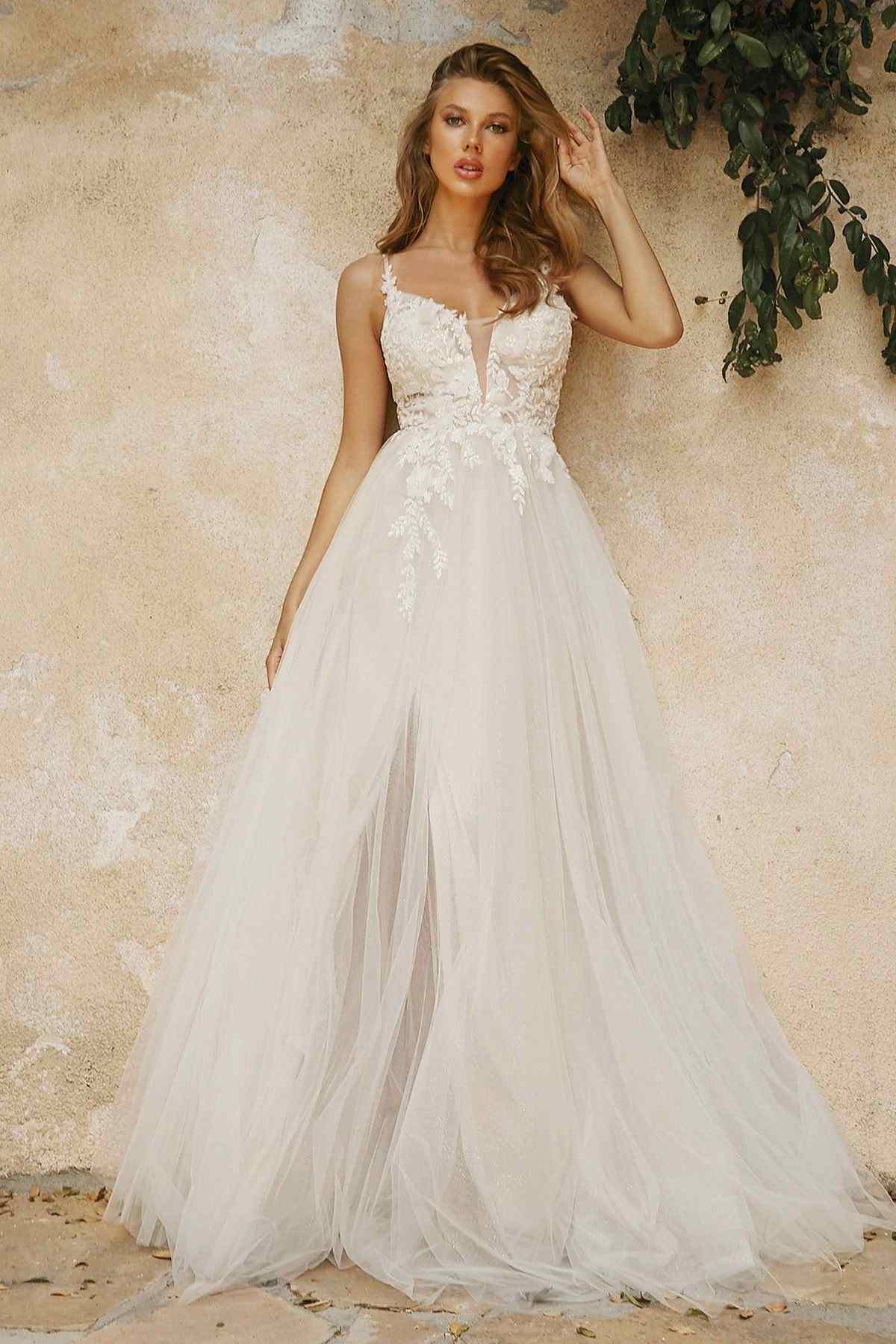 Off-white layered tulle bridal gown with embroidered bodice and flowing A-line skirt