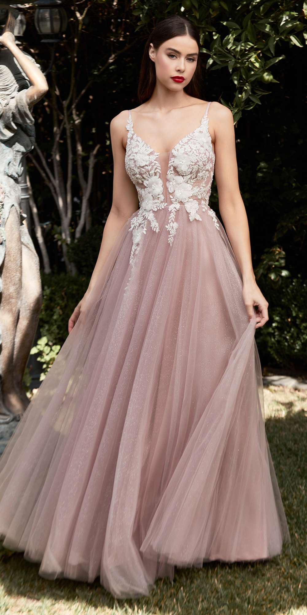 Champagne long A-line tulle gown with embroidered lace bodice and flowing pleated skirt.