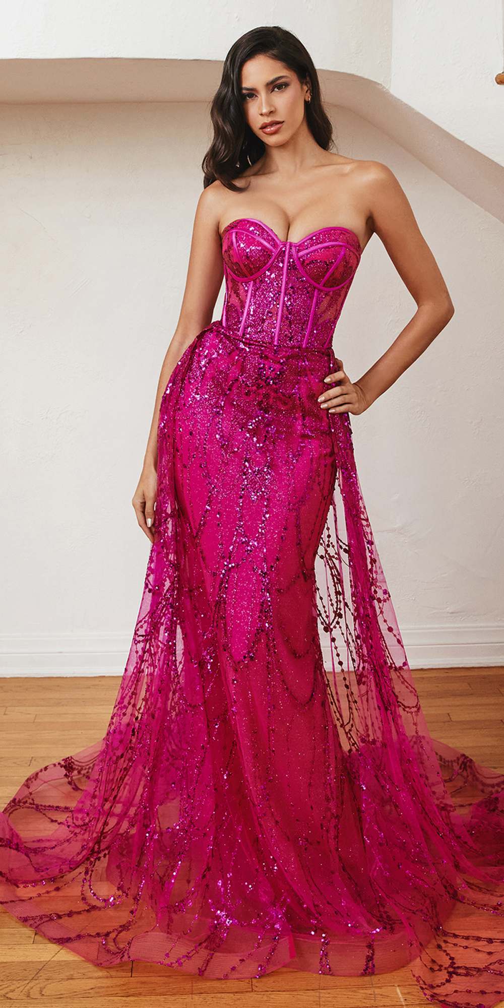 Fuchsia strapless corset gown with sparkling beadwork and layered tulle skirt
