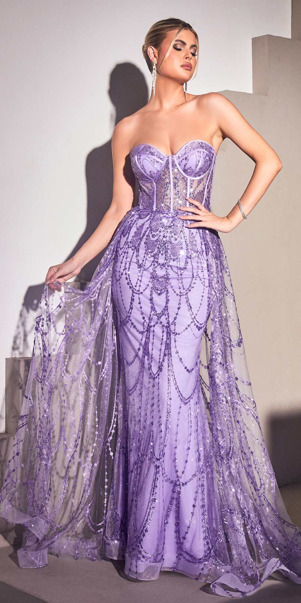 Purple strapless corset gown with sparkling beadwork and draped layered skirt