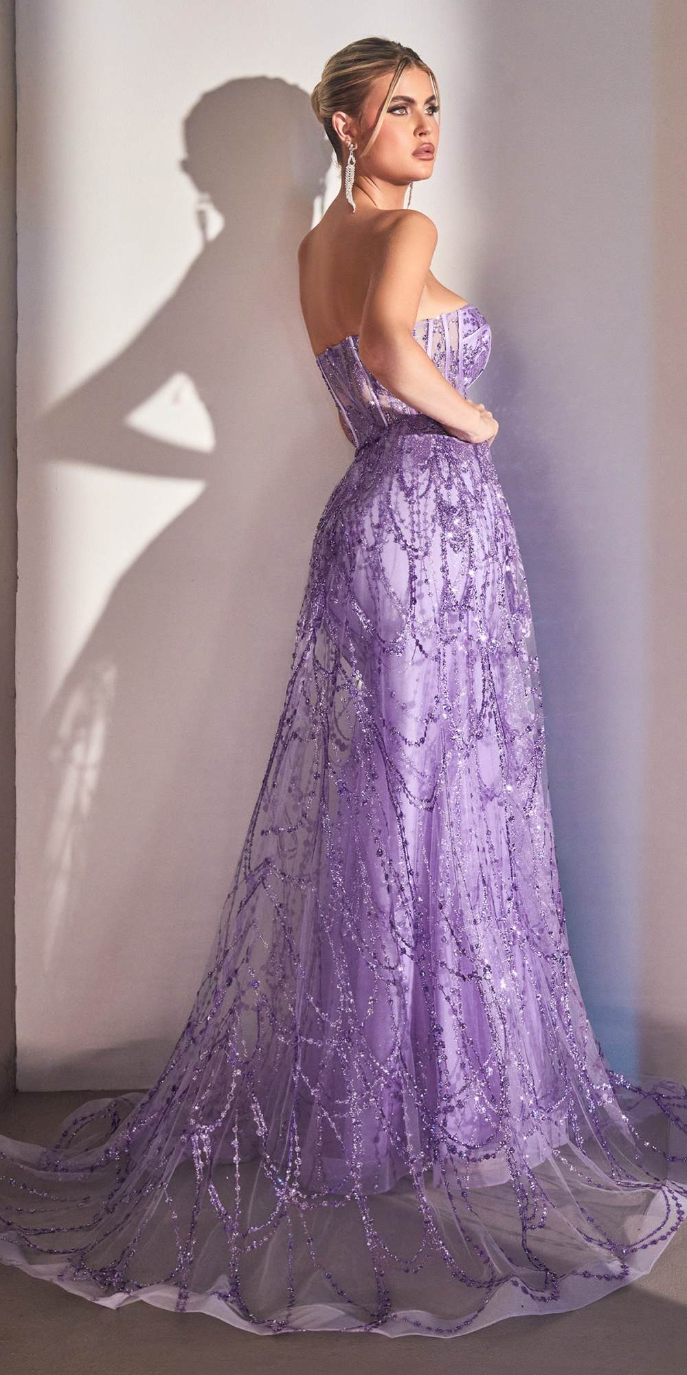 Purple lace strapless corset gown with embellished bodice and full flowing skirt