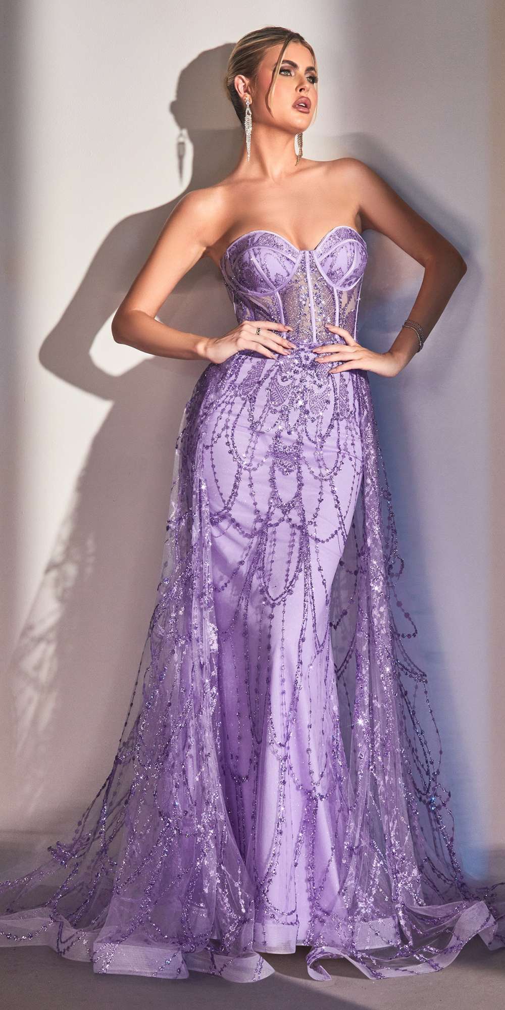 Purple strapless corset gown with sparkling lace details and flowing layered skirt