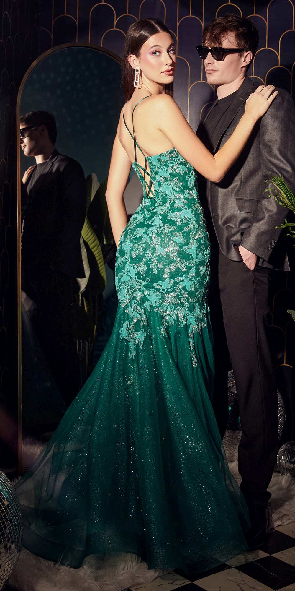 Emerald green mermaid gown with butterfly lace print, thin straps, fitted skirt