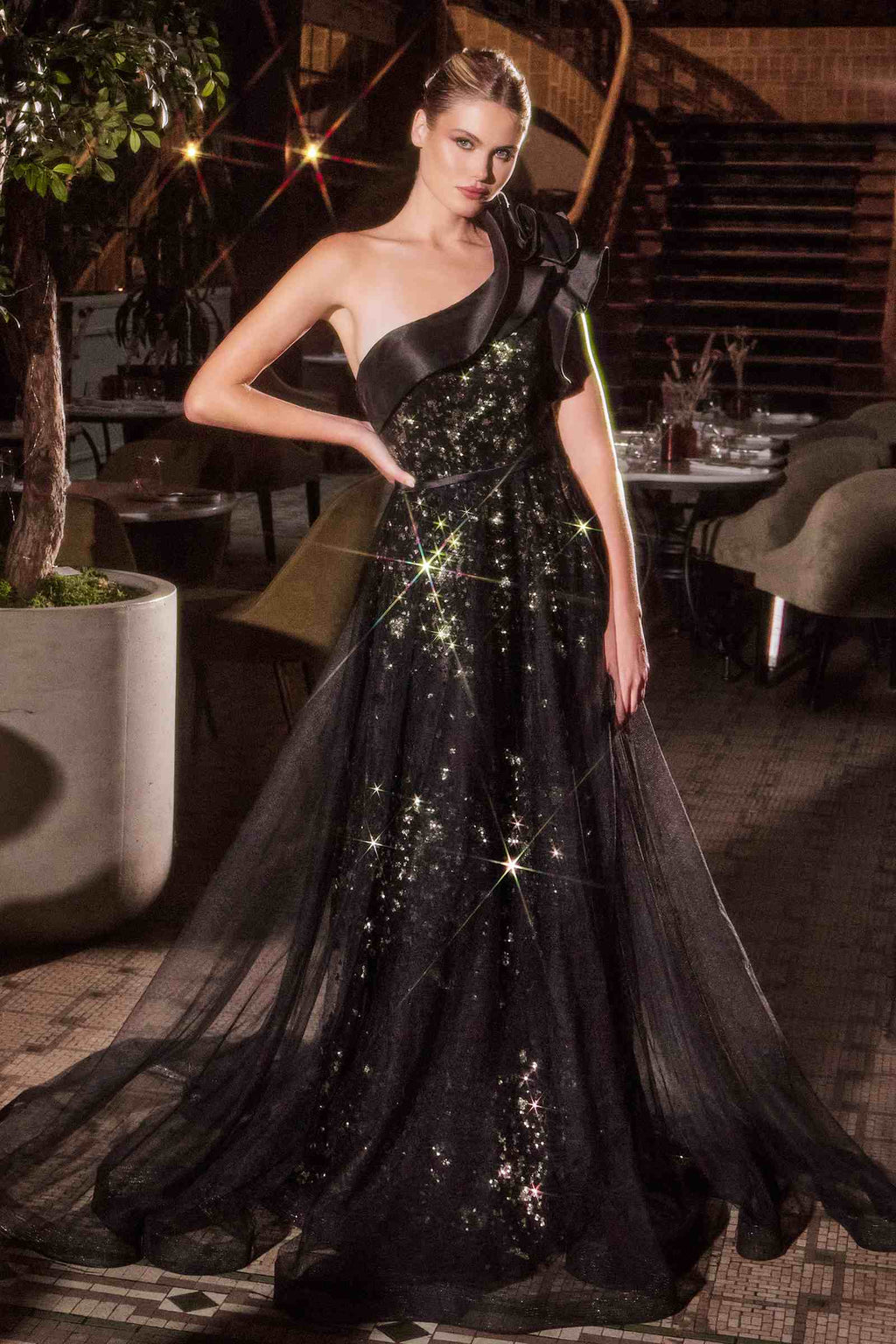 Black one-shoulder ball gown with flowing tulle skirt and glittering sequin detail