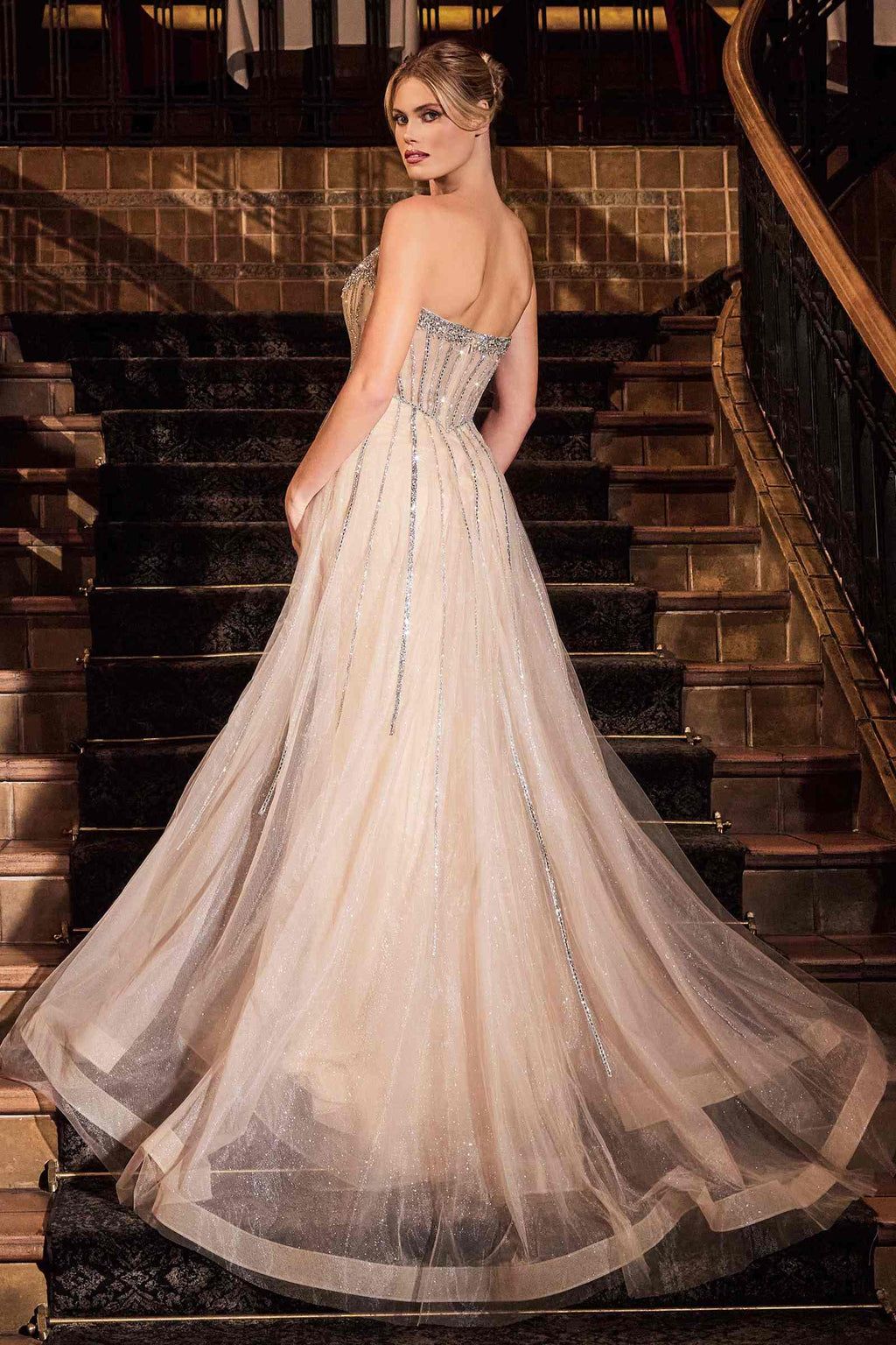 Embellished strapless evening gown with sparkling bodice and full tulle skirt, silver-toned
