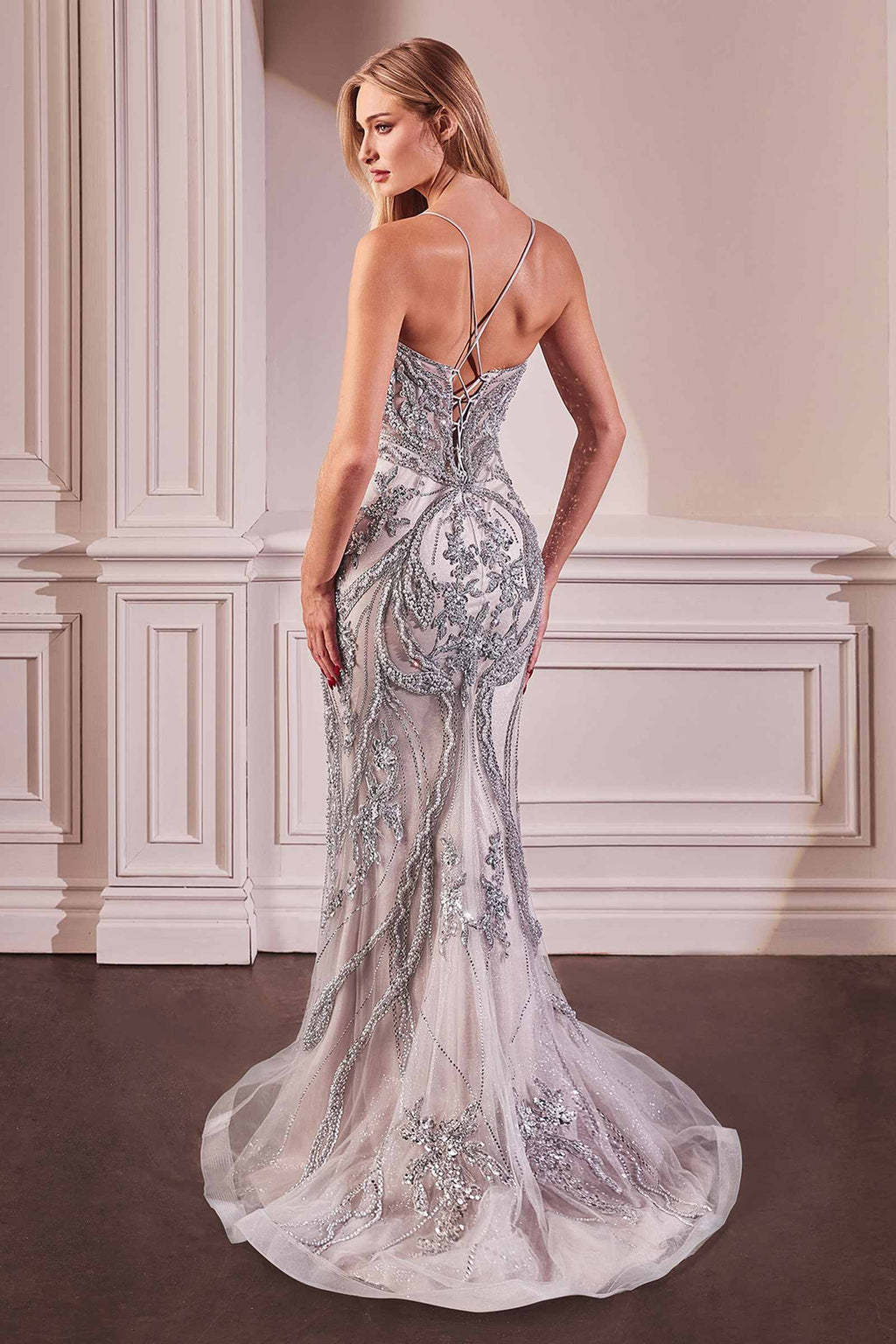 Silver pearl-embellished gown with open back, thin spaghetti straps, and fitted waist