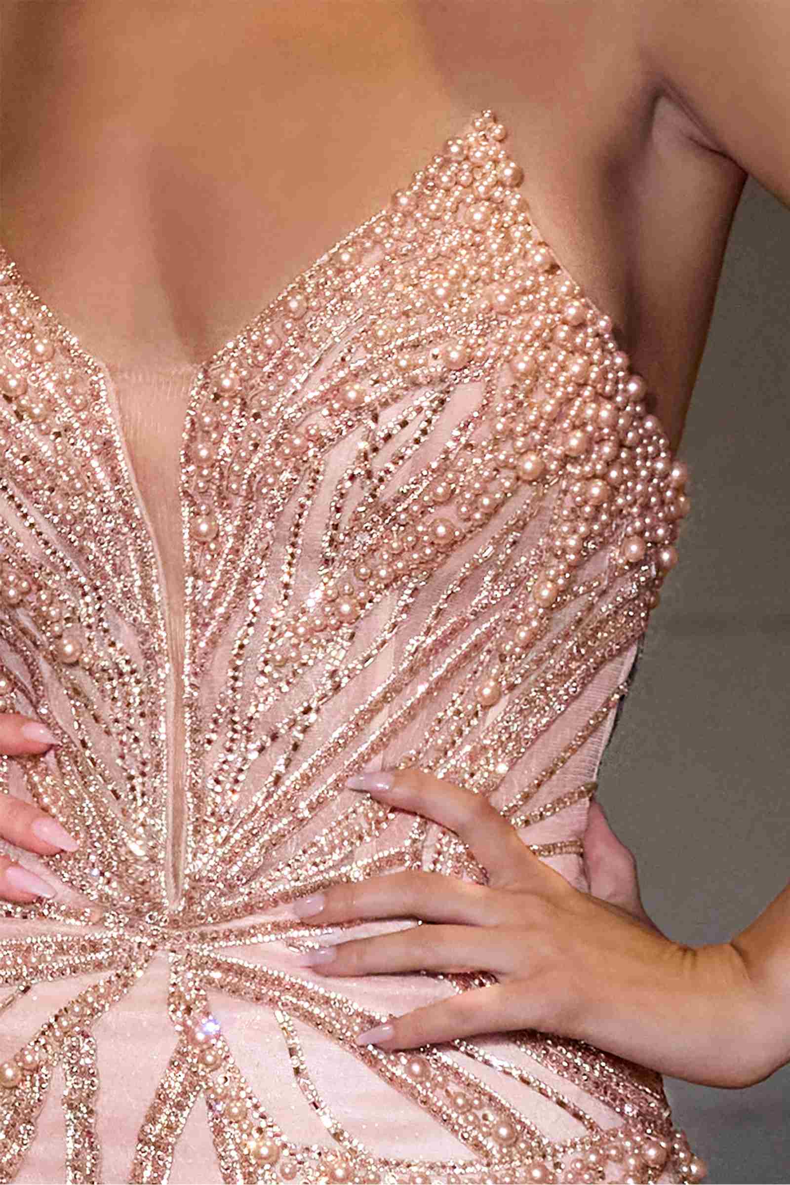 Pink sequin strapless gown close-up with sparkling bead embroidery on bodice