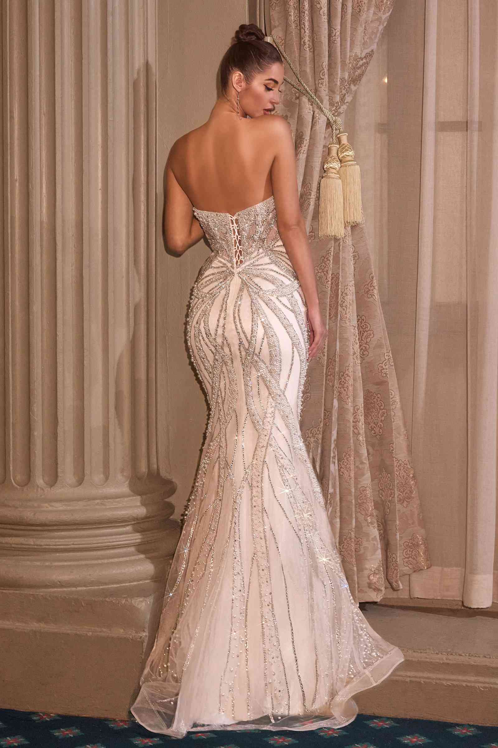 Off-white strapless fitted bridal gown with beaded corset bodice and mermaid hem