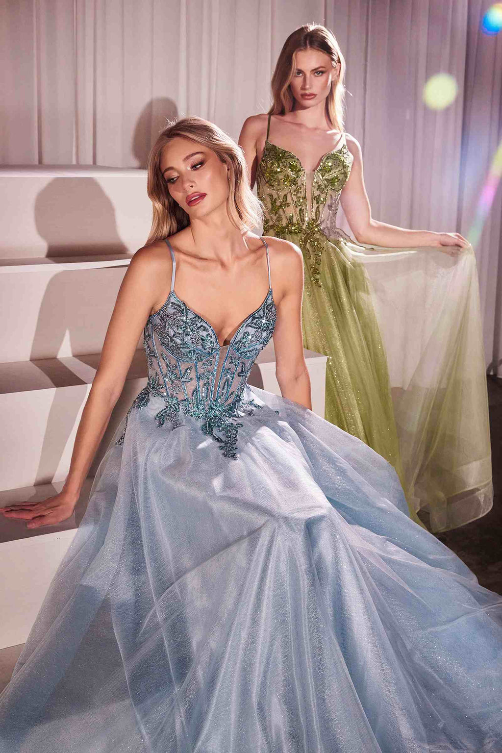 Light blue A-line tulle gown with lace embellished bodice and thin spaghetti straps