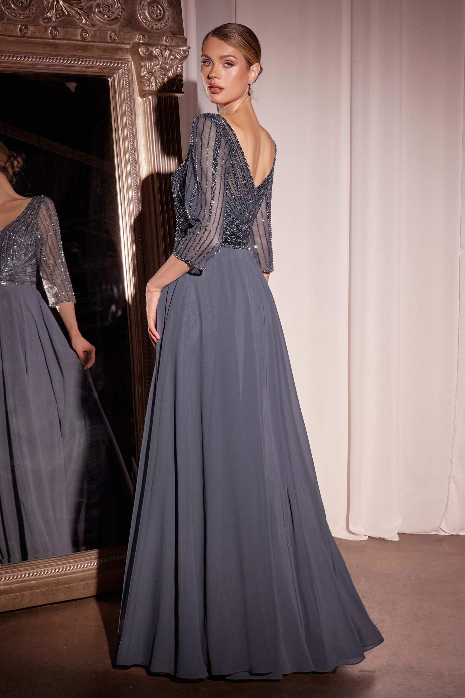Blue-gray chiffon evening dress with beaded neckline and flowing pleated skirt
