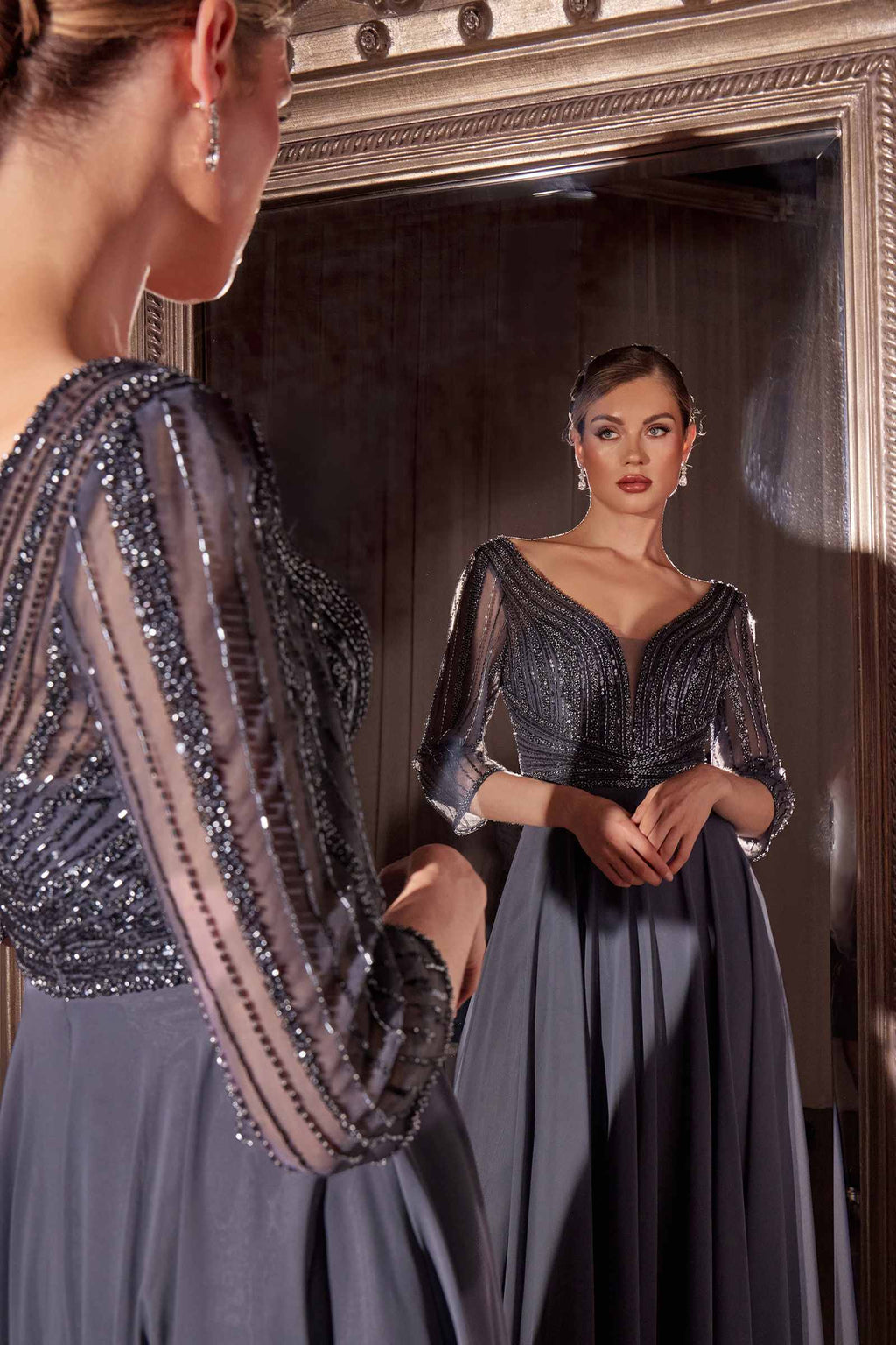 Blue-gray beaded chiffon dress with V-neckline and three-quarter sleeves
