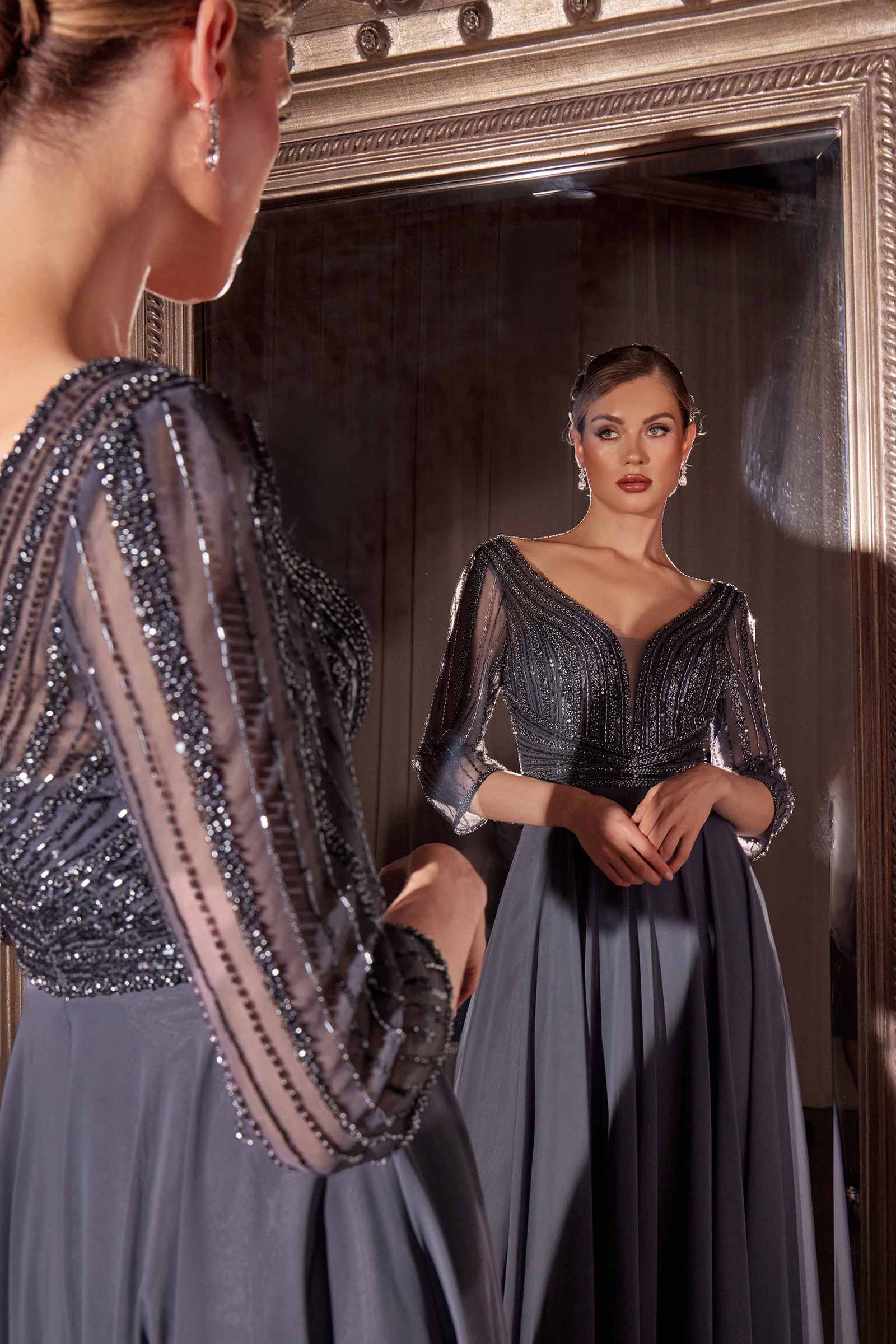 Blue-gray beaded chiffon dress with V-neckline and three-quarter sleeves