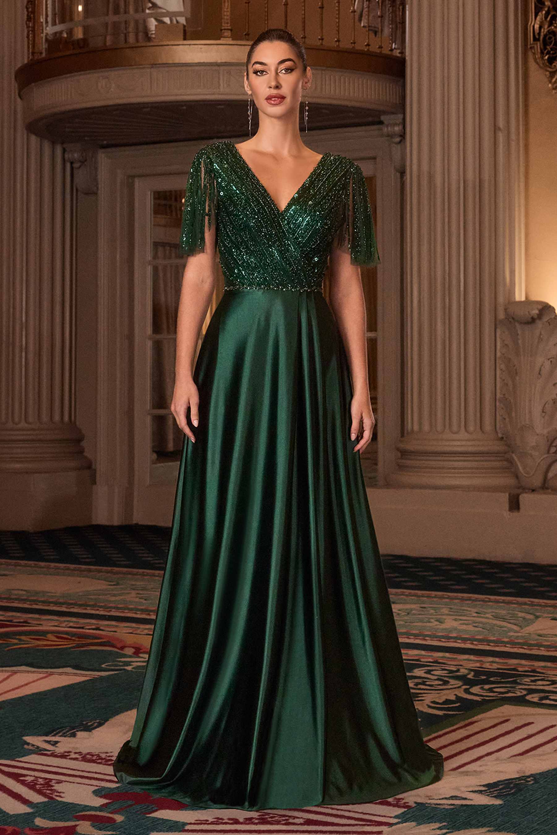 Emerald satin evening gown with V-neckline, flutter sleeves, and A-line skirt