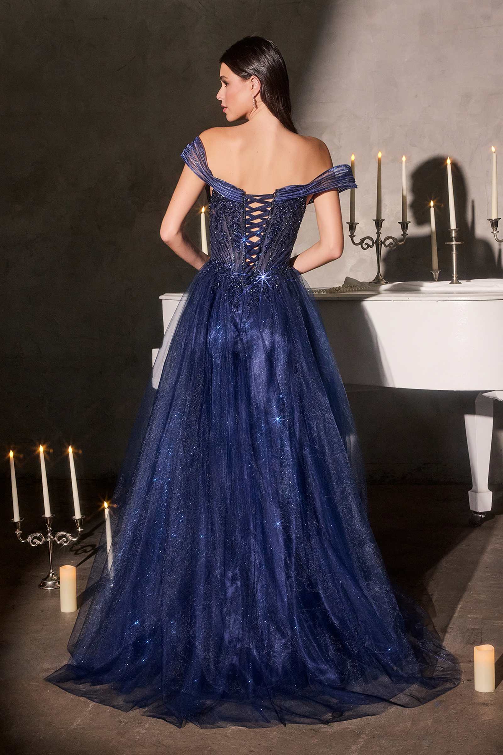 Dark blue off-shoulder tulle ball gown with lace-up corset bodice and full skirt