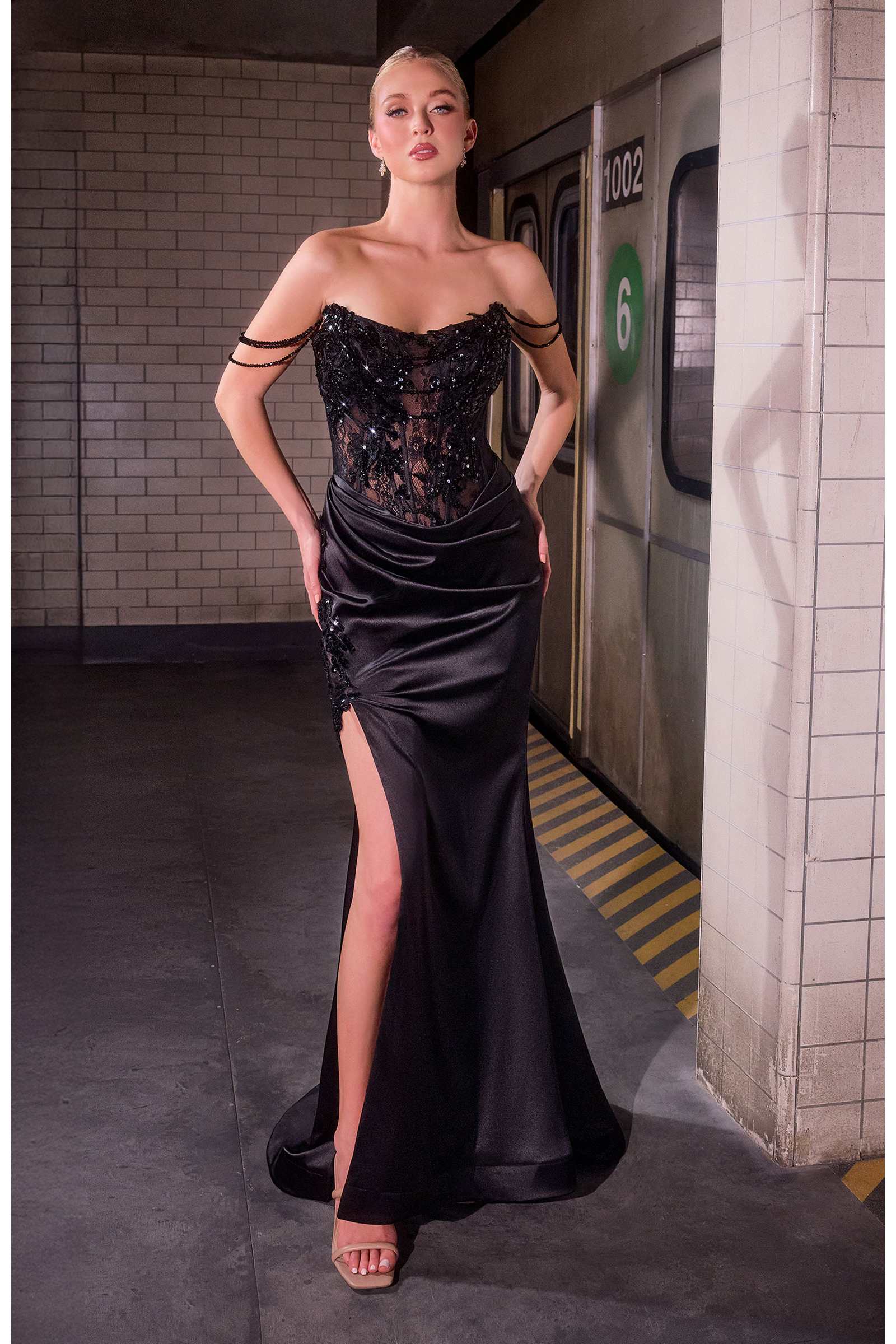 Black satin evening gown with sweetheart lace bodice and thigh-high slit