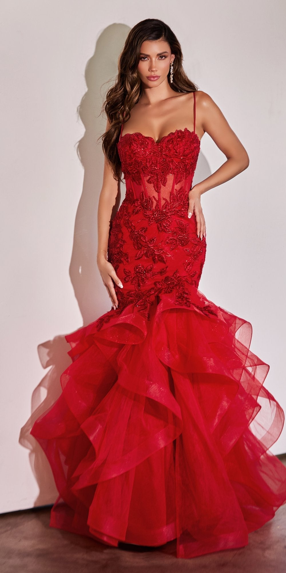 Red lace mermaid dress with thin straps, fitted bodice, and layered ruffle skirt