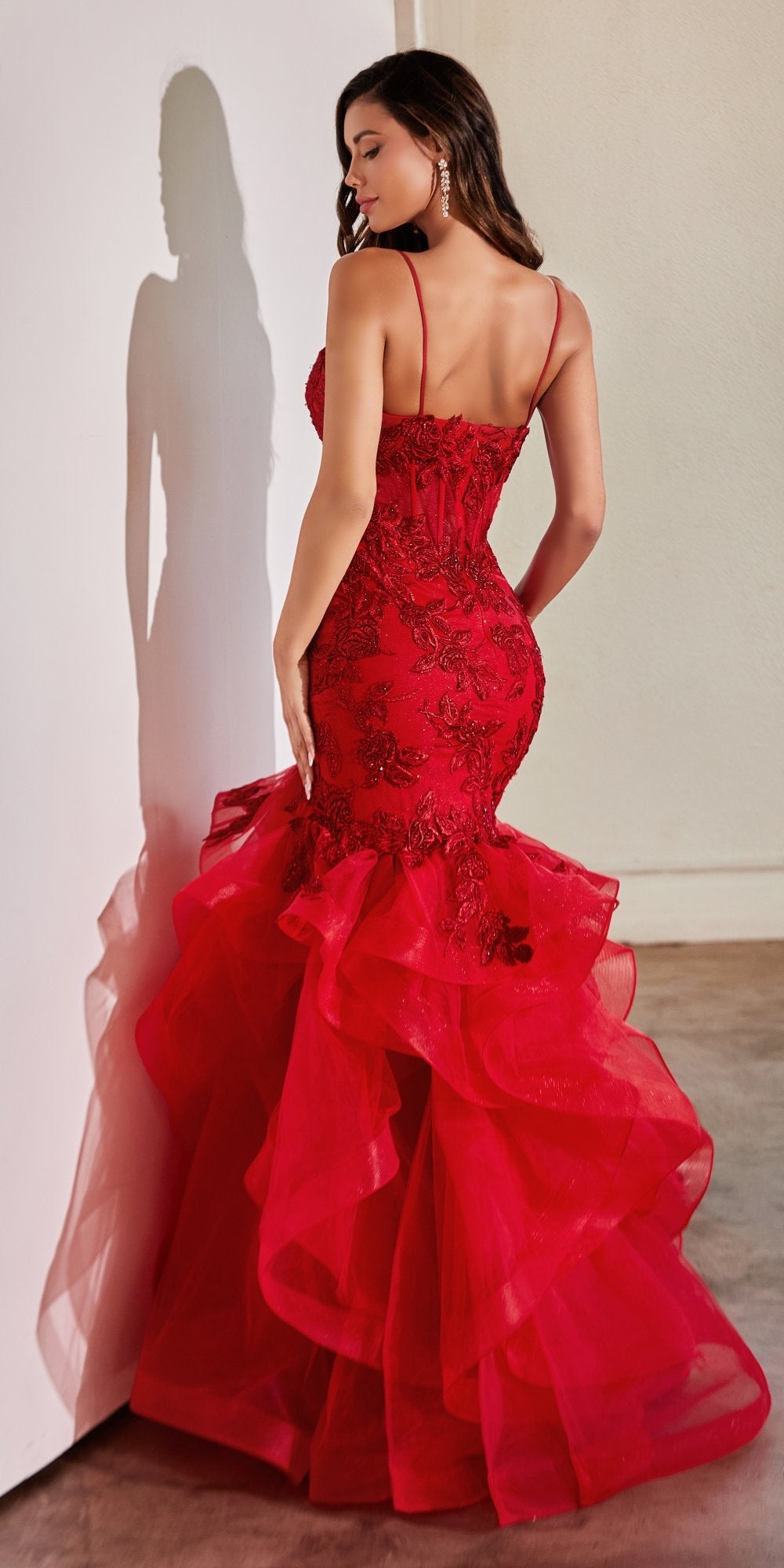 Red lace mermaid dress with thin straps and layered ruffle skirt, back view