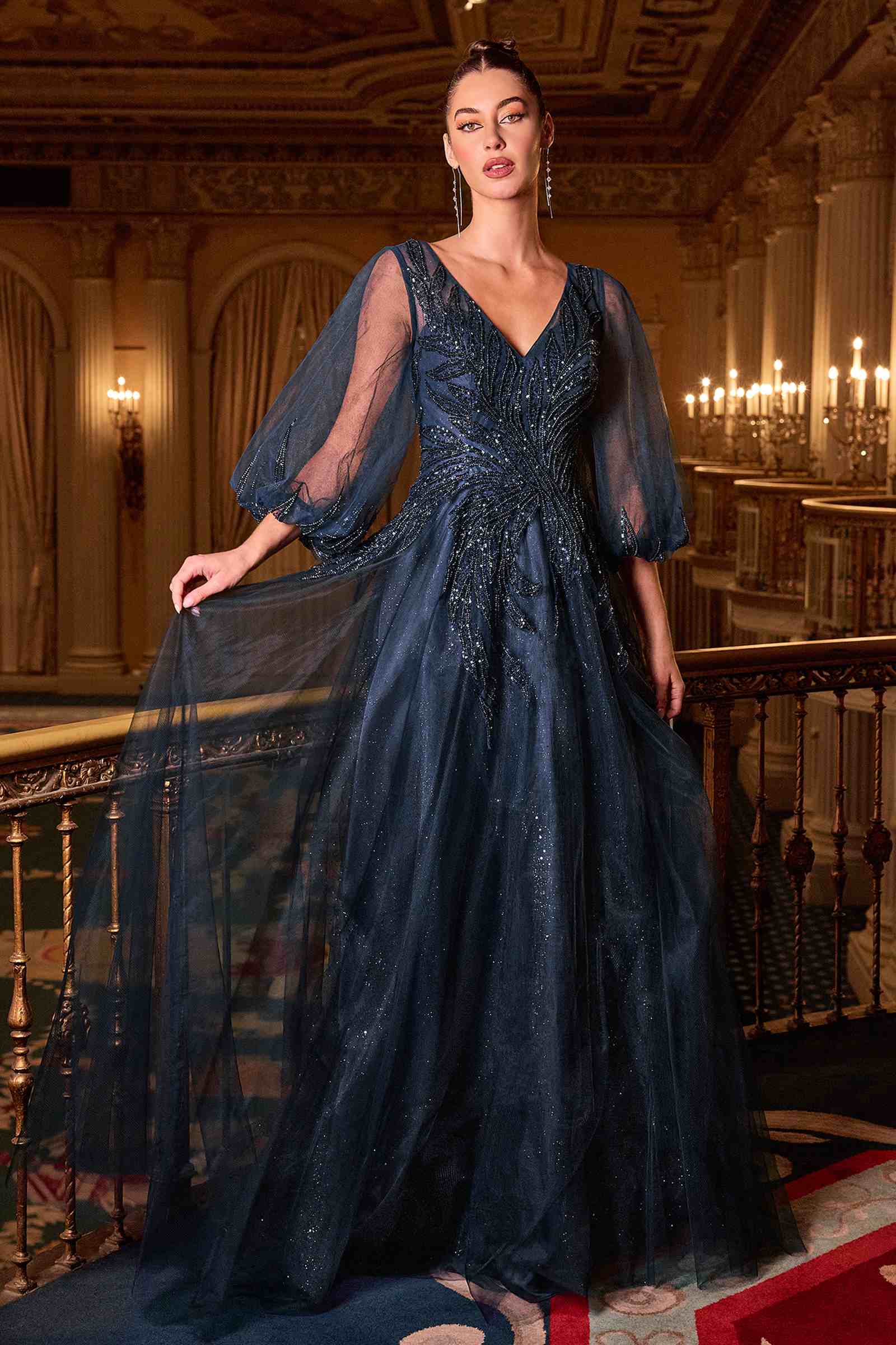 Navy blue V-neck A-line gown with flowing layered tulle skirt and sheer three-quarter sleeves