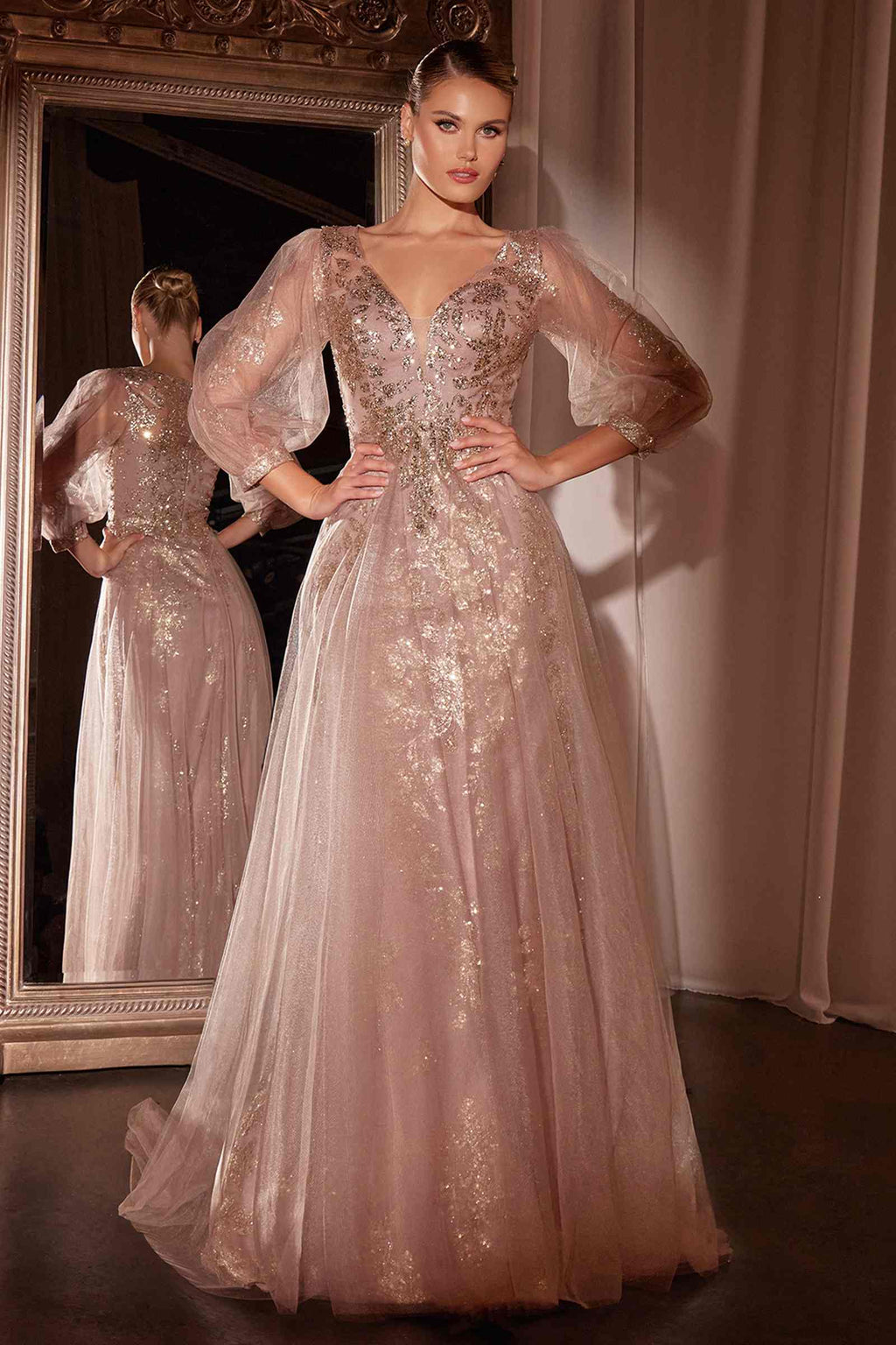 Long sleeve light pink A-line tulle gown with sequined bodice and sheer puff sleeves