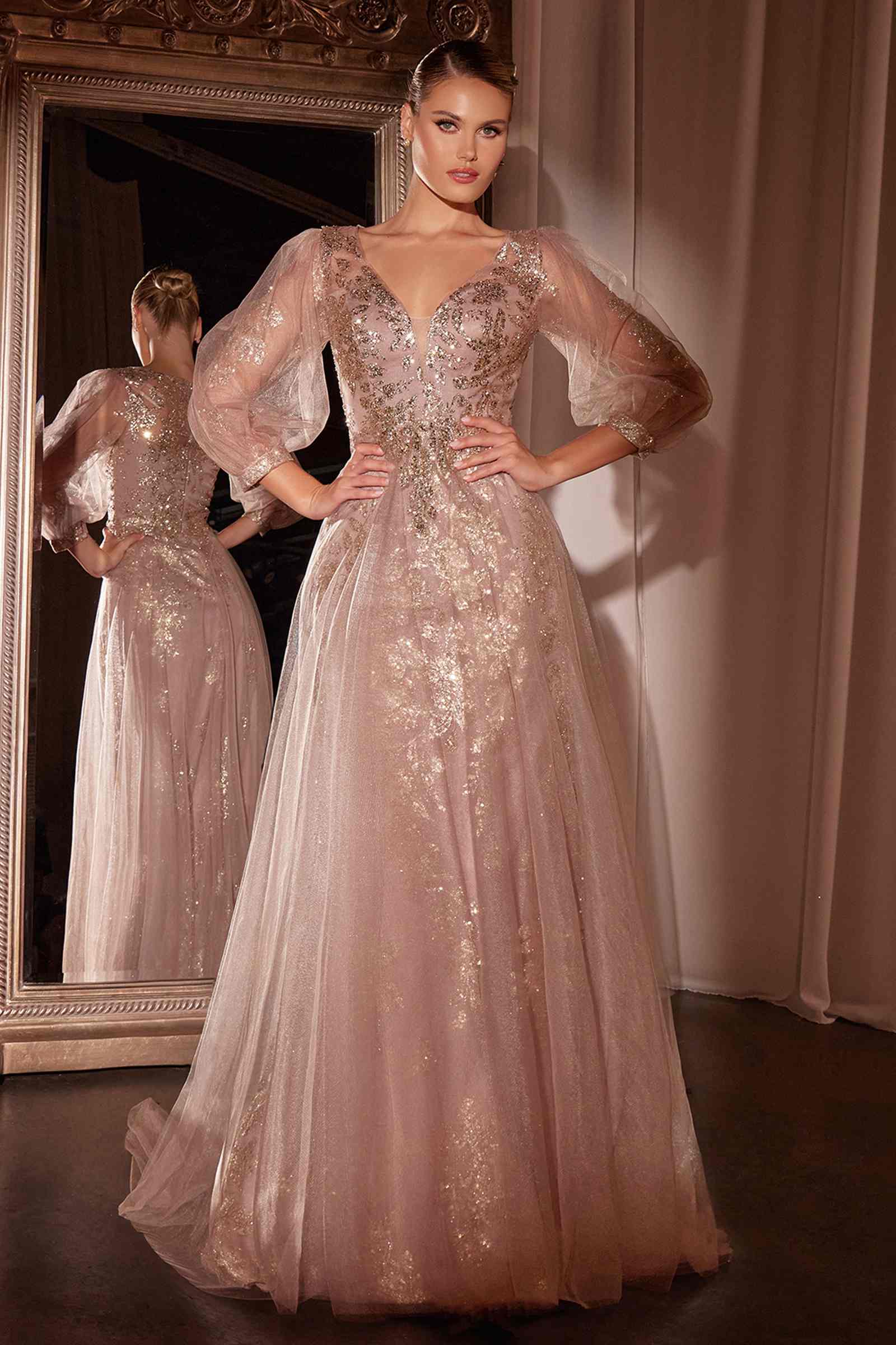 Long sleeve light pink A-line tulle gown with sequined bodice and sheer puff sleeves