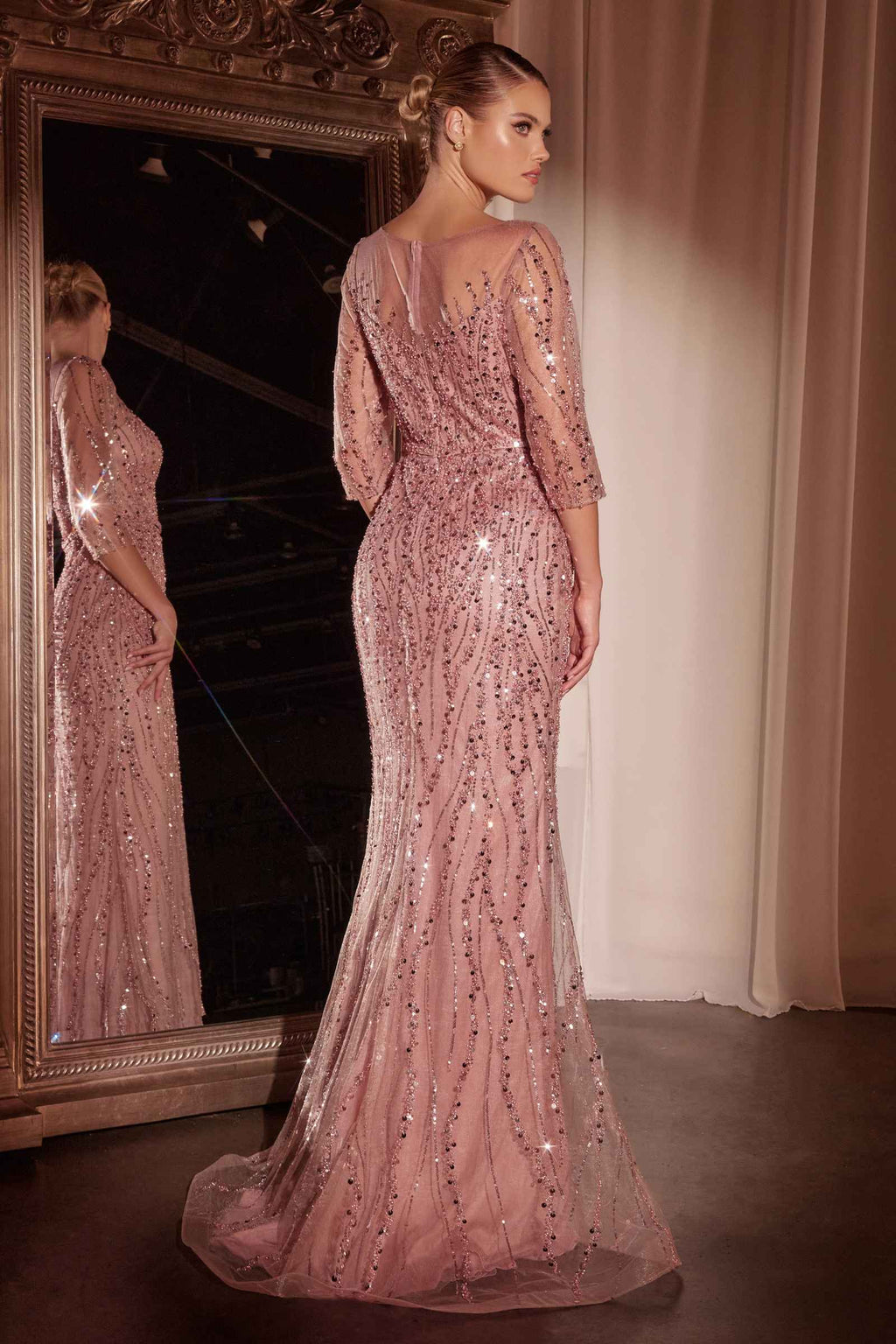 Dusty rose sequin mermaid gown with long sleeves and fitted fishtail silhouette